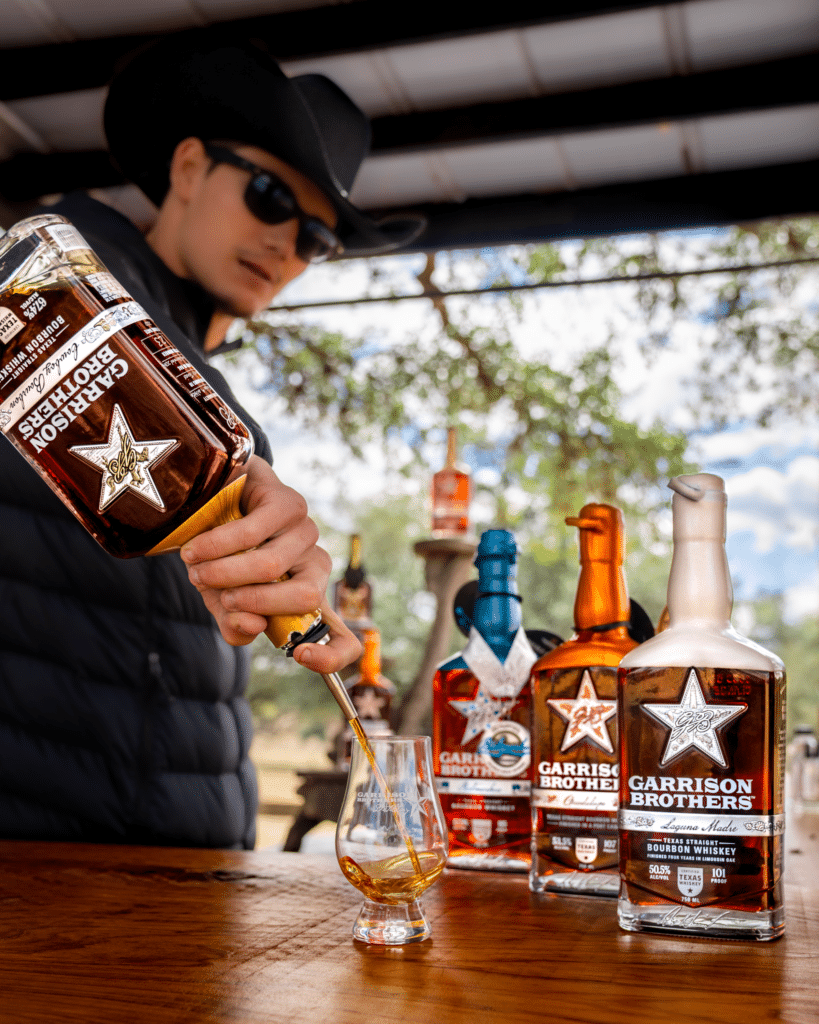 Custom-made private bar at Hye Reserve, Garrison Brothers Distillery, offering exclusive bourbon tastings in the Texas Hill Country sunshine.